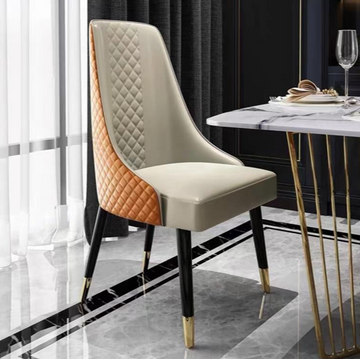 Luxury Dining Chair: Quilted Orange Leather & Gold-Tipped Steel Legs